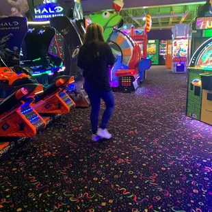 Employee walking away from bumper cars while talking on the phone leaving the bumper cars unattended