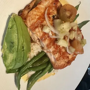 a plate of fish and vegetables
