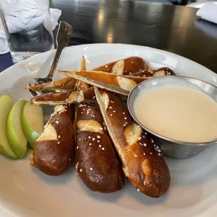 Soft pretzels with White Cheddar Fondue and apples
