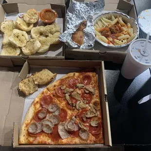 Two slices pepperoni and sausage pizza. Garlic knots. Butter knots. Penne with meatballs.