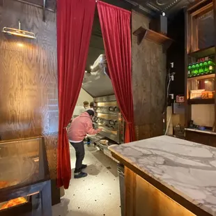 a woman preparing food in a restaurant