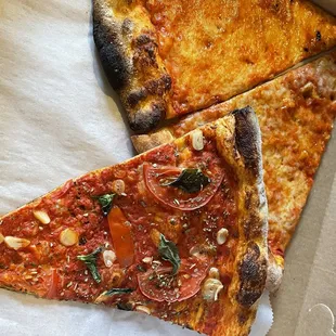 two slices of pizza in a box