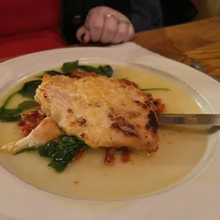 a plate of food with a knife and fork