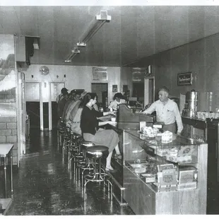 The bar looking west in early 1950's. The guy behind the bar there is Evert, he build the bar.