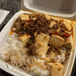 tofu and rice in a styrofoam container