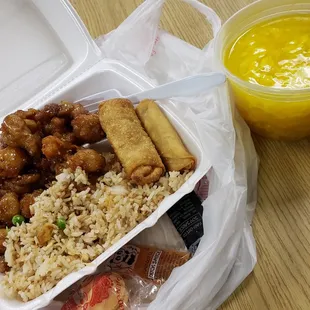 Sesame chicken, egg roll and some other roll fried rice and egg drop soup