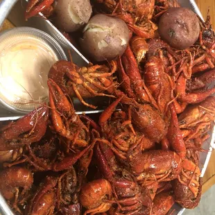 a bowl of crawfish and potatoes