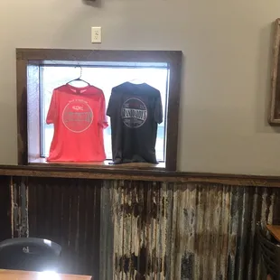 two t - shirts on a window sill