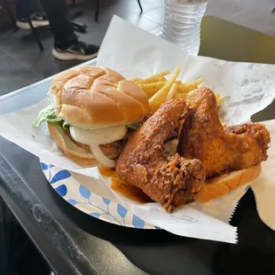 Two mild jumbo wings, fries and fried pork chop sandwich