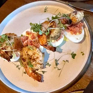 DEVILED EGGS - Grilled Cajun shrimp, potato crisp, tazo ham, chili oil.