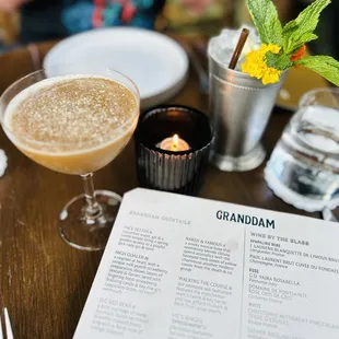 a drink and menu on a table