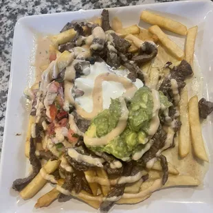 Carne azada fríes option of adding bacon and chorizo