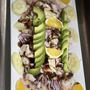 Ceviche campechano shrimp, octopus our home made sauce marinated in lime and pico , avocado ,cucumber with slices of orange