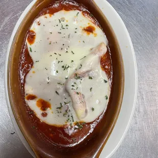 a dish of cheese and sauce
