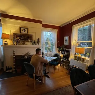 a man sitting at a table in a living room