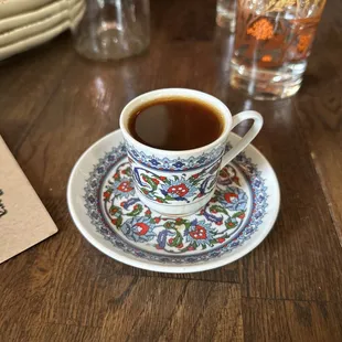 a cup of coffee on a saucer