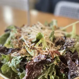 a bowl of salad on a table