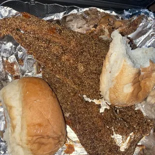 a chicken sandwich with a side of bread