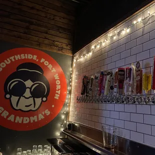 a row of beer taps in a bar