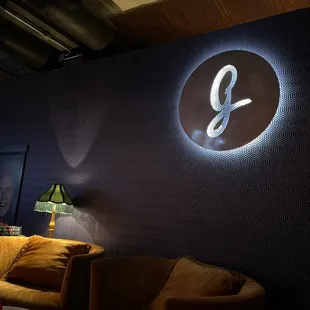 a living room with a couch and a lamp