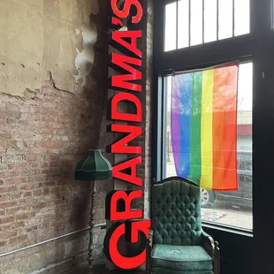 a chair and a rainbow flag