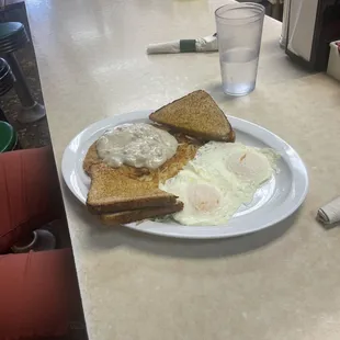 Fried eggs, gravy on a biscuit.