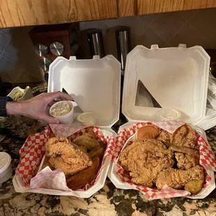 two baskets of fried chicken