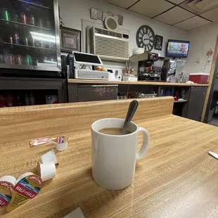 a cup of coffee on a table