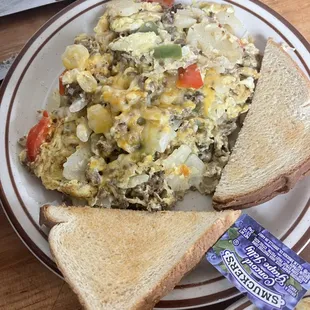Sausage, eggs, cheese, potatoes, peppers &amp; onions.