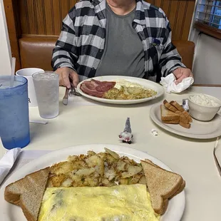 Sausage and cheese omelet and amazing home fries.