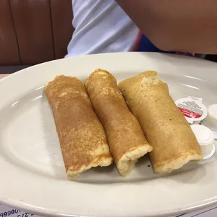 Pigs in blankets. (Sausage wrapped in pancakes)