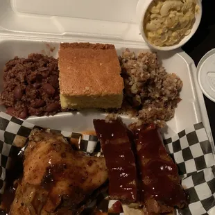 Combo with barbecue ribs, jerk chicken, Mac n cheese, cornbread &amp; I think it was baked pork &amp; beans then hash.