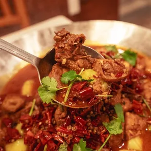 a bowl of stew with meat and vegetables