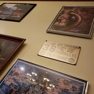 a collection of posters on the wall