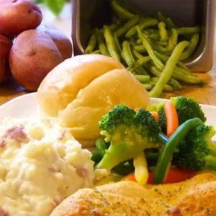 Parmesan Garlic Chicken Breast with garlic red skin mashed potatoes and tuscan vegetable blend.