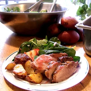Pork Loin with currant sauce, oven roasted potatoes and a strawberry spinach salad.