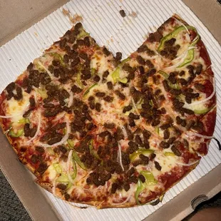 Supposed to be a large beef, green peppers and onion pizza but the toppings are bunched in certain spots instead of evenly spread out