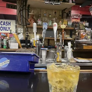 a drink in a glass on a bar