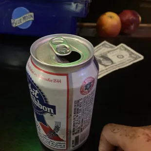 a can of bud on a table
