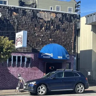 a car parked in front of the restaurant