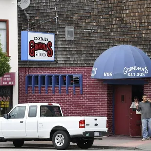 a truck parked in front of a building