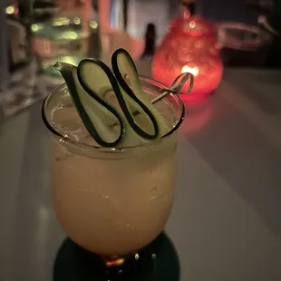 a cucumber cocktail in a glass