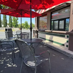 Outside seating by menu. Other side from drive thru window.