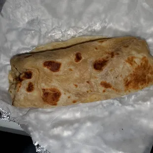 Ham, potato, and egg breakfast burrito.