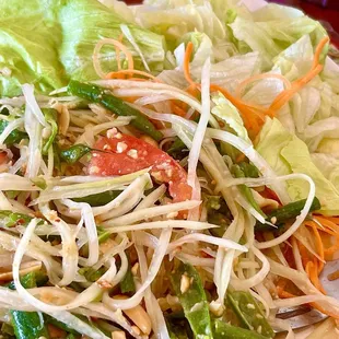 Huge potion of Green Papaya salad with lots of lettuce and green beans.