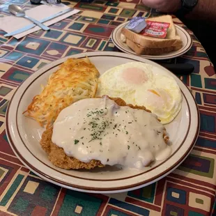 Chicken fried chicken, eggs and toast