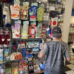 a man standing in front of a display of candy