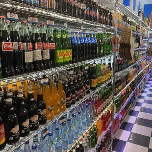 shelves full of sodas and soft drinks