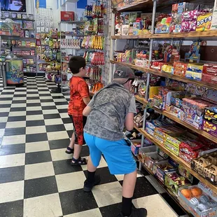 a man and a boy shopping in a store