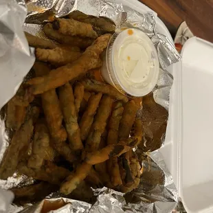 "Spicy" Fried Green Beans, Frank's Red Hot sauce (I think) over frozen, breaded green beans.